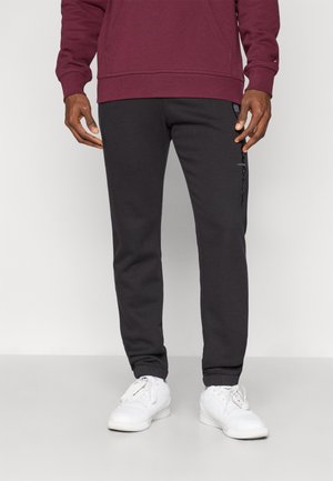 Champion ICONS TONAL CUFF PANTS LARGE LOGO - Pantalon de survêtement - black