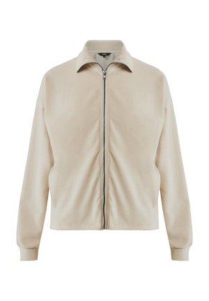 Veste zippée beige avec une texture douce, dotée d'un col rabattu et de poignets côtelés, conçue avec une coupe décontractée et des poches latérales.