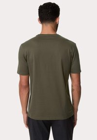 Olivengrøn T-shirt med kortærmer, lavet af glat stof, rund halsudskæring, afslappet pasform og subtil syning ved kanten.