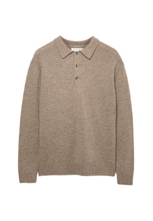 Beige gebreide pullover trui met een kraag, sluiting met drie knopen en geribbelde onderkant. Zachte textuur met een subtiel patroon door het hele oppervlak.