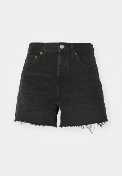 Black denim shorts with a high waist, frayed hem, and copper-tone rivets. Features a classic five-pocket design and button closure.