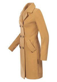 Manteau croisé en laine camel avec revers crantés, manches longues et poches frontales inclinées, vu de profil.
