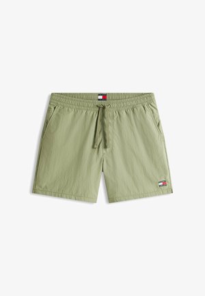 Lichtgroene heren zwemshorts met elastische tailleband, trekkoord, zijzakken en een kleine Tommy Jeans logo applicatie op het been.