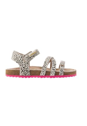 White sandal with black spots, featuring three straps and a Velcro closure. Brown footbed and pink rubber sole with a textured pattern.