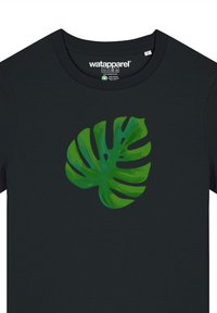 Schwarzes T-Shirt mit einem großen, grünen Monstera-Blatt-Grafikdruck auf der Vorderseite, das unterschiedliche Grüntöne und detaillierte Blattmuster zeigt.
