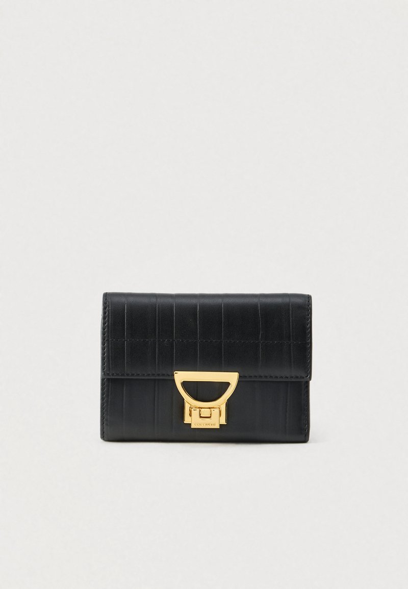 Black leather wallet with horizontal stitching and a gold-tone geometric clasp on a light background.