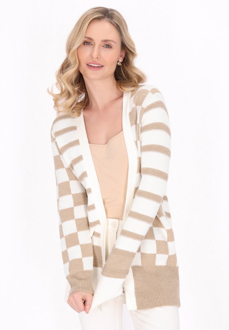 Cardigan a righe beige e bianche con apertura davanti, polsini e orlo a coste. Realizzato in morbido materiale a maglia, presenta una vestibilità comoda.