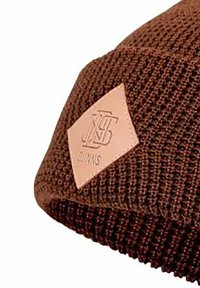 Brown knitted beanie with a textured pattern. Features a light brown leather patch with embossed logo.
