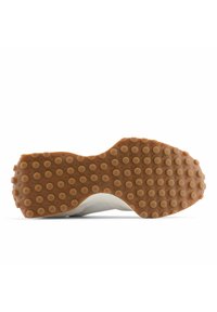 Sole of a white shoe with brown rubber outsole featuring evenly spaced round nubs for traction and grip.