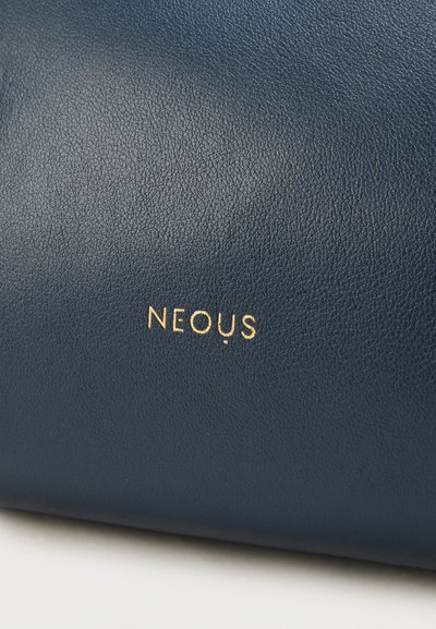 Navy leather handbag with a textured finish, featuring a gold embossed logo “NEOUS” centered on the surface.