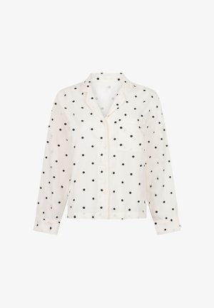 Chemise blanche à manches longues à boutons, ornée de pois noirs, avec une poche poitrine et un col cranté. Texture de tissu lisse.