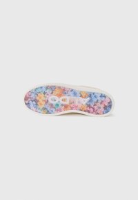 Shoe sole with a textured white base featuring a colorful pattern of flowers in shades of pink, blue, and yellow. "ALDO" logo visible.
