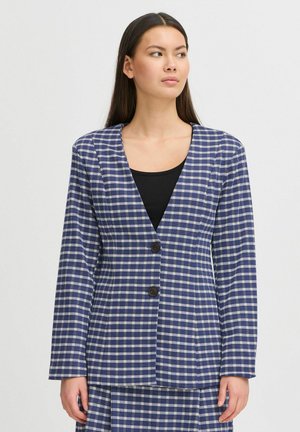 Navy and white checkered blazer with a V-neck, long sleeves, two buttons, and a structured design. Patterned fabric adds texture.