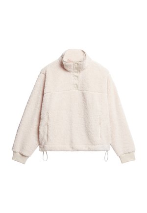 Roomkleurige fleece trui met hoge kraag, drukknopen en zijzakken. Heeft elastische manchetten en een verstelbare zoom met trekkoord.