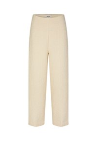 Cream-colored cropped pants made of textured fabric with subtle patterns. Features a high waist and a straight-leg silhouette.