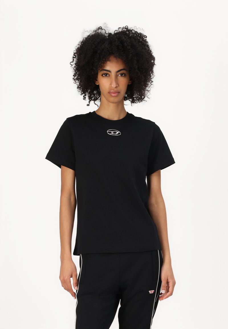 Black cotton t-shirt with a crew neck, short sleeves, and a small logo on the chest. Smooth texture, relaxed fit.