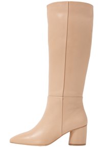 Knee-high beige leather boot with a pointed toe and block heel, featuring a smooth texture and minimalistic design.