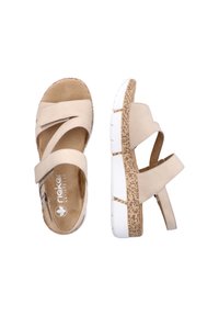 Sandales beiges à bout ouvert avec brides ajustables, semelle intermédiaire à texture liège et semelle extérieure en caoutchouc blanc segmentée, vues de dessus et de côté.