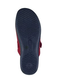 Red felt shoe with a navy rubber sole. The sole features a textured, patterned grip for traction. Side includes an adjustable strap.