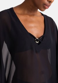 DORINA MOKOLO COVER UP - Rannatarvikud - black