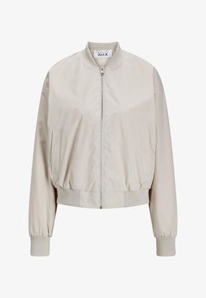 Light beige bomber jacket with a zip front, elastic waistband, and cuffs. Made of smooth material; features side pockets and a round collar.
