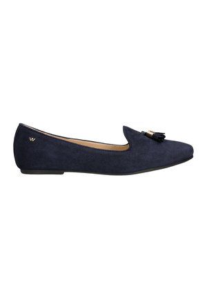 Suede navy flat shoe with a pointed toe, featuring a small gold accent and a decorative tassel. Cushioned interior for comfort.