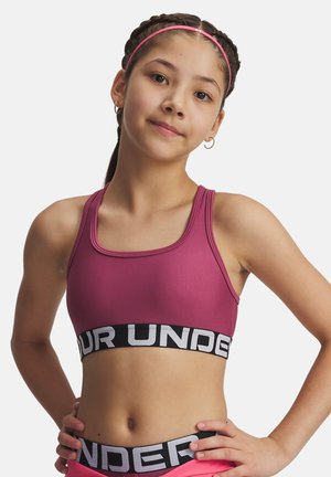 Fuchsia sportbh med en åtsittande design, som har ett brett svart band med vit text. Slät textur, rund ringning och inga fästen.