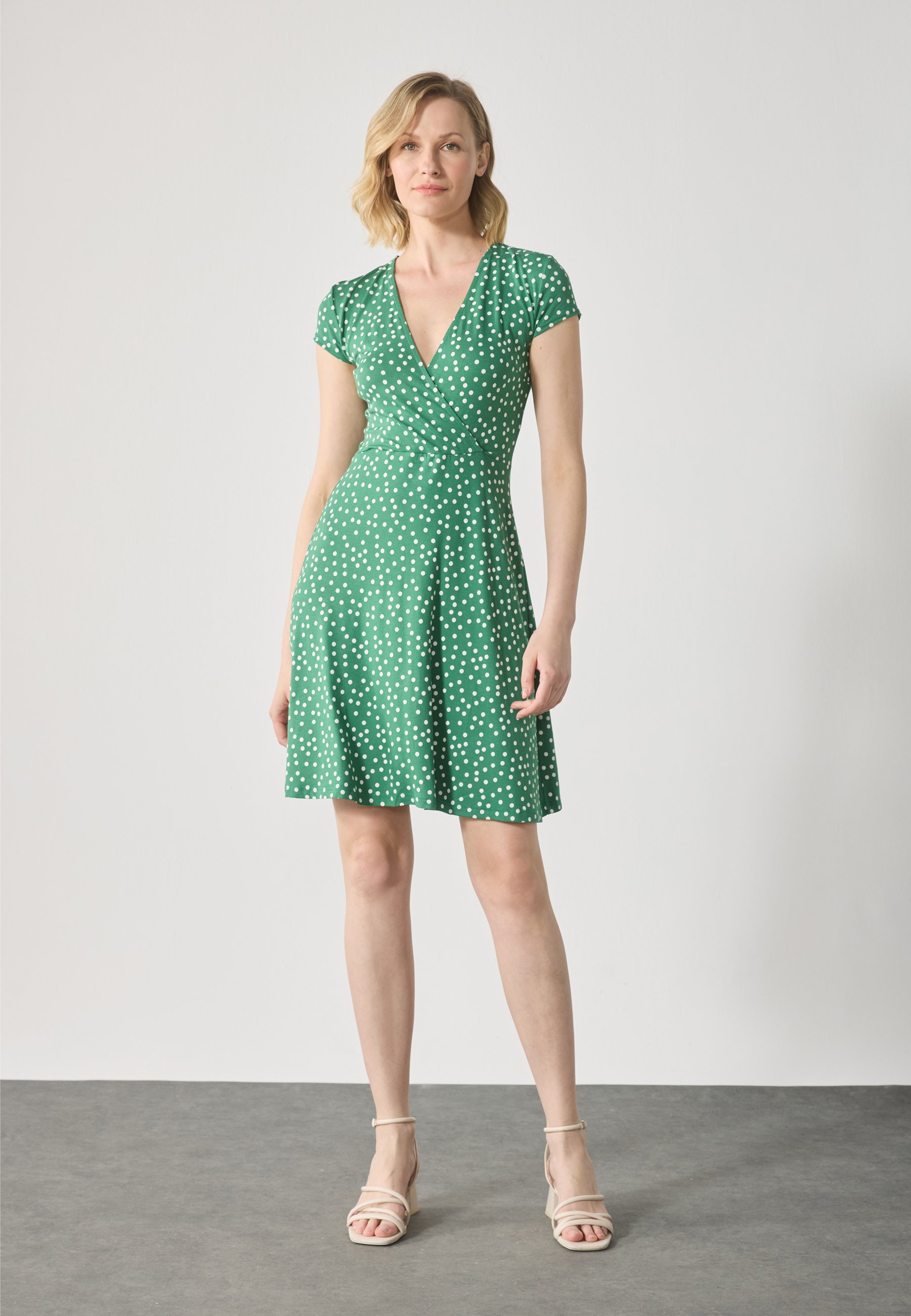 green and white jersey dress