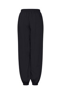 Pantalon noir à coupe ample avec taille élastique et poignets aux chevilles, conçu pour un usage décontracté ou sportif.