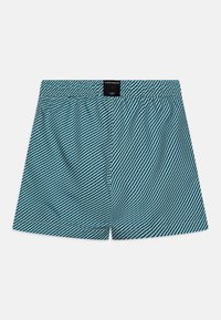 Boxershorts v tyrkysovej farbe s bielymi diagonálnymi prúžkami. Elastický pás s čiernou brand značkou na zadnej strane. Ľahká, priedušná tkanina.