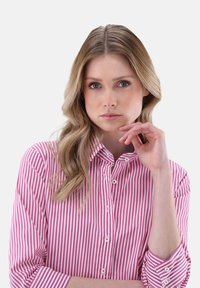Long-sleeve button-up shirt featuring alternating pink and white vertical stripes, lightweight fabric, and a classic collar design.