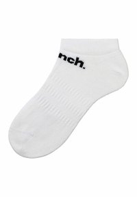 Weiße Knöchelsocke aus Rippstoff, mit schwarzem Text "nch." oben gedruckt. Glatte Textur und runde Zehenform.