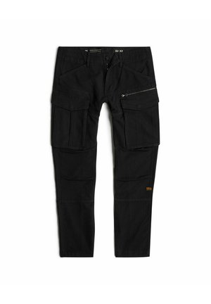 Pantalons cargo noirs en tissu durable. Dotés de plusieurs poches, d'une poche latérale zippée et d'un petit logo orange. Coupe standard.