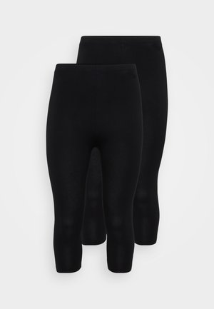 Zwarte stretchleggings in een naadloos ontwerp, met een lengte tot halverwege het onderbeen, een gladde textuur en een elastische tailleband voor comfort.