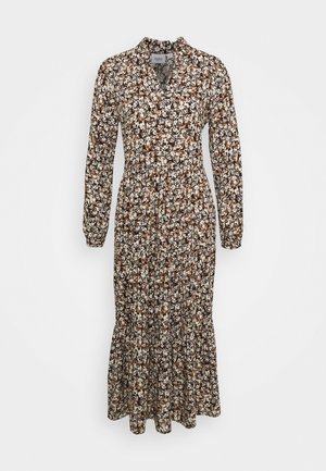 Sukienka w kwiaty z długim rękawem, z czarnym tłem, białymi i brązowymi wzorami kwiatowymi, kołnierzykiem i rozkloszowanym dołem.