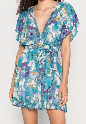 Floral wrap dress in blue, featuring short ruffled sleeves, deep V-neck, cinched waist with a tie, and textured fabric with colorful patterns.