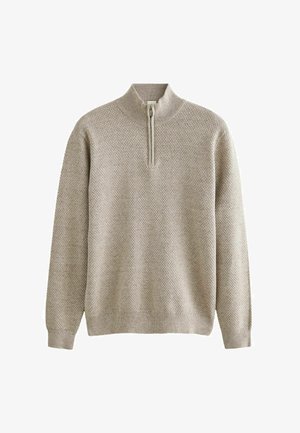 Bežinis megztinis su pusiau užtrauktuku, su tekstūruotu raštu ir raukšlėmis rankogaliuose bei apatinėje dalyje. Minkšta medžiaga, kasdienis dizainas.