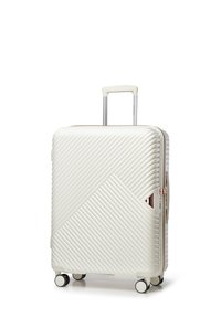Hard-shell suitcase in off-white with a diagonal ribbed pattern. Features a retractable handle and four wheels for easy maneuverability.