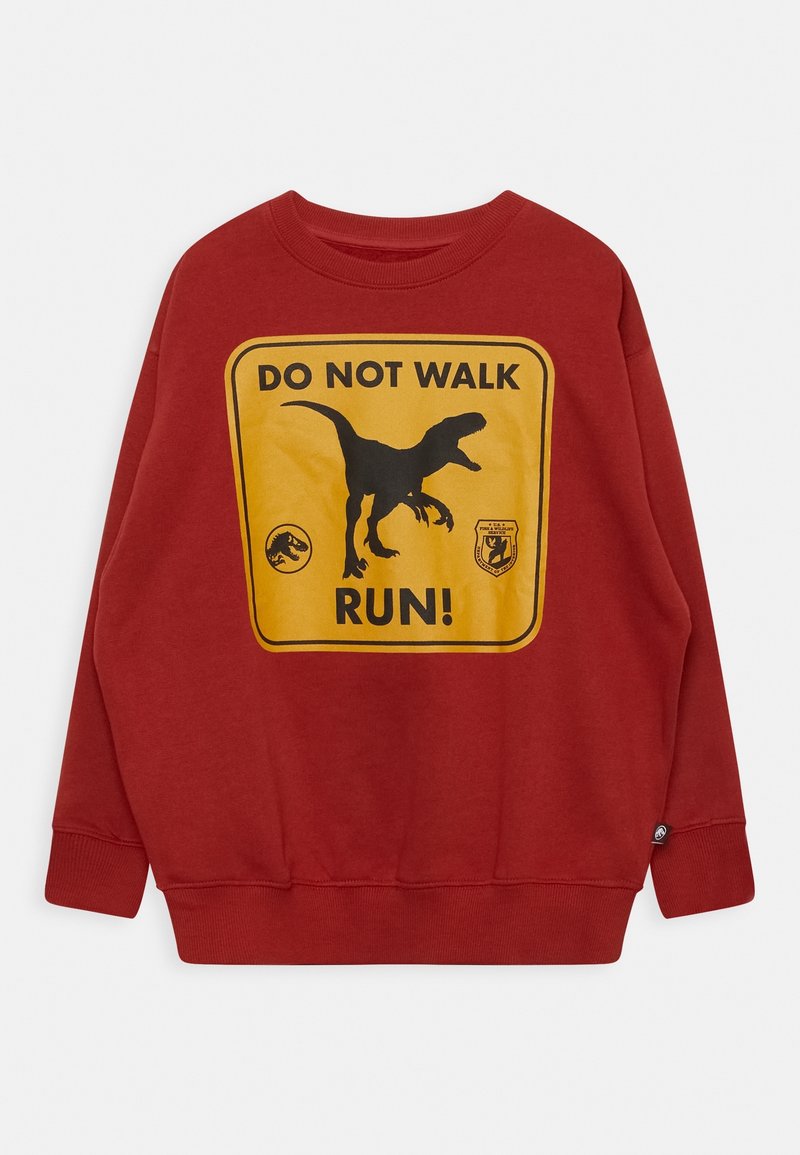 Sweat-shirt rouge avec un panneau jaune affichant la silhouette noire d'un dinosaure et le texte « NE MARCHEZ PAS, COURREZ ! » en lettres noires en gras.