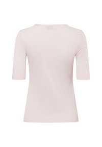 Lichtroze, geribbelde top met korte mouwen, een ronde halslijn en een losse pasvorm. Glad textuur met een eenvoudig ontwerp, geen zichtbare logo's of patronen.