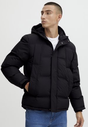Black puffer jacket with a hood, featuring quilted sections, zip closure, and side pockets; made from smooth, insulating material.