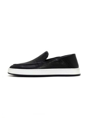 Black slip-on shoes made of textured leather with a white rubber sole, featuring a streamlined design and subtle stitching detail.