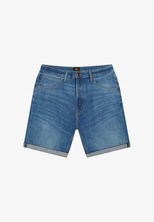 Sinised teksapüksid, millel on ülespööratud ääred, esiosa taskud, vööaasad, nööpidega kinnis ja Lee kaubamärgiga silt vööjoonel.