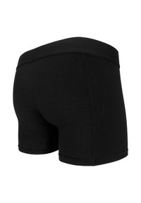 Black boxer shorts featuring a soft elastic waistband, made from a smooth cotton blend fabric, with a fitted design and no visible patterns.