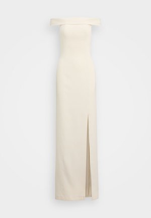 Off-the-shoulder, floor-length dress in cream fabric. Features a side split for ease of movement and a tailored, fitted silhouette.