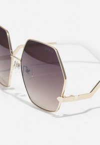 Guess Solbriller - gold-coloured