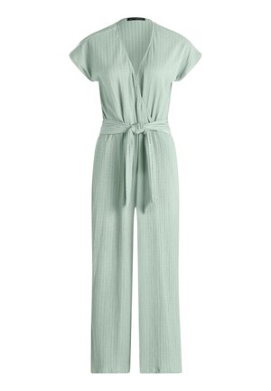 Világoszöld bordázott kötött overál rövid ujjakkal, V-nyakú átfedős elülső résszel, derekán megkötős, és széles szárú.