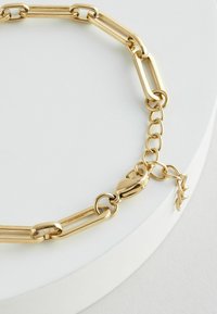 Next Armband - gold tone