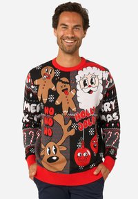 Crni božićni džemper s crvenim naglascima, s ilustracijama animiranih sobova, Djeda Mraza, medenjaka i božićnim natpisom. Pleteni dizajn, svečani uzorci.