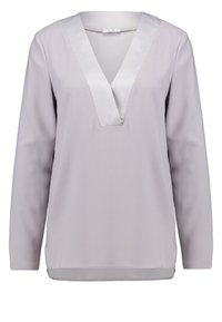 Blusa grigio chiaro a maniche lunghe con scollatura a V e dettagli in satin. Tessuto morbido e vestibilità rilassata, con orlo dritto nella parte inferiore.